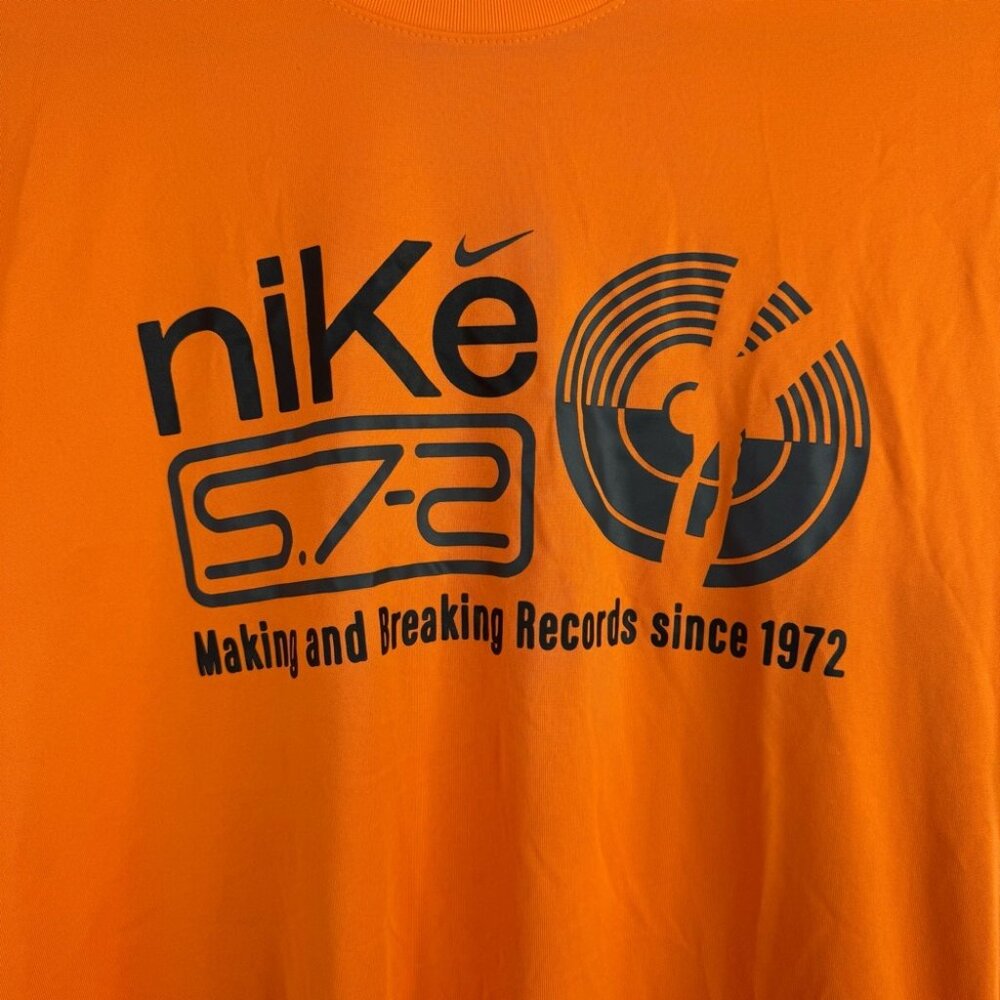 Nike tshirt dri-fit the Nike tee since 1972 Orange Graphic Short Sleeve Tee - Picture 2 of 7